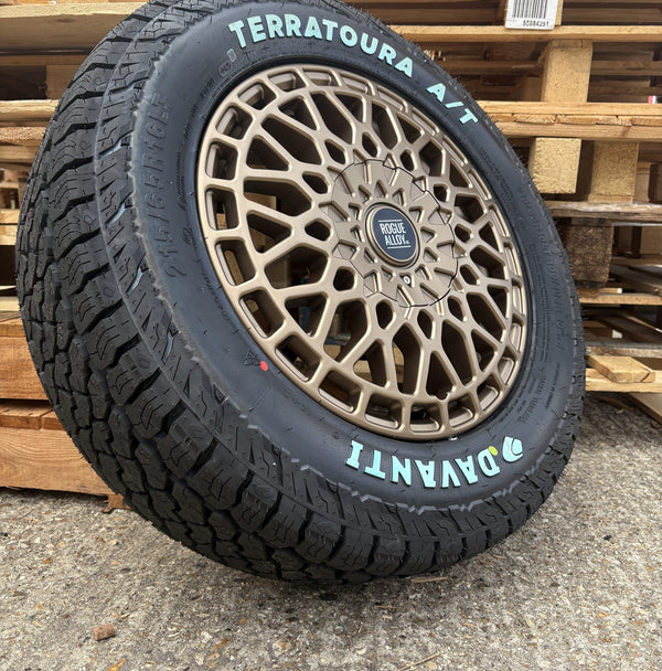 A bronze mesh wheel and Davanti leaning on pallets