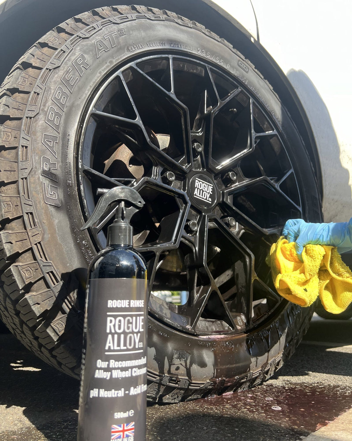 Wiping down a black Rogue wheel with Rogue Alloy Rinse